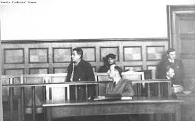 black and white photo of Krampf and his legal team in court
