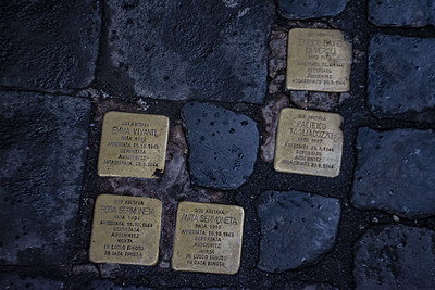 photo of 4 golden cobblestones with the names of Jewish victims of the Holocaust 